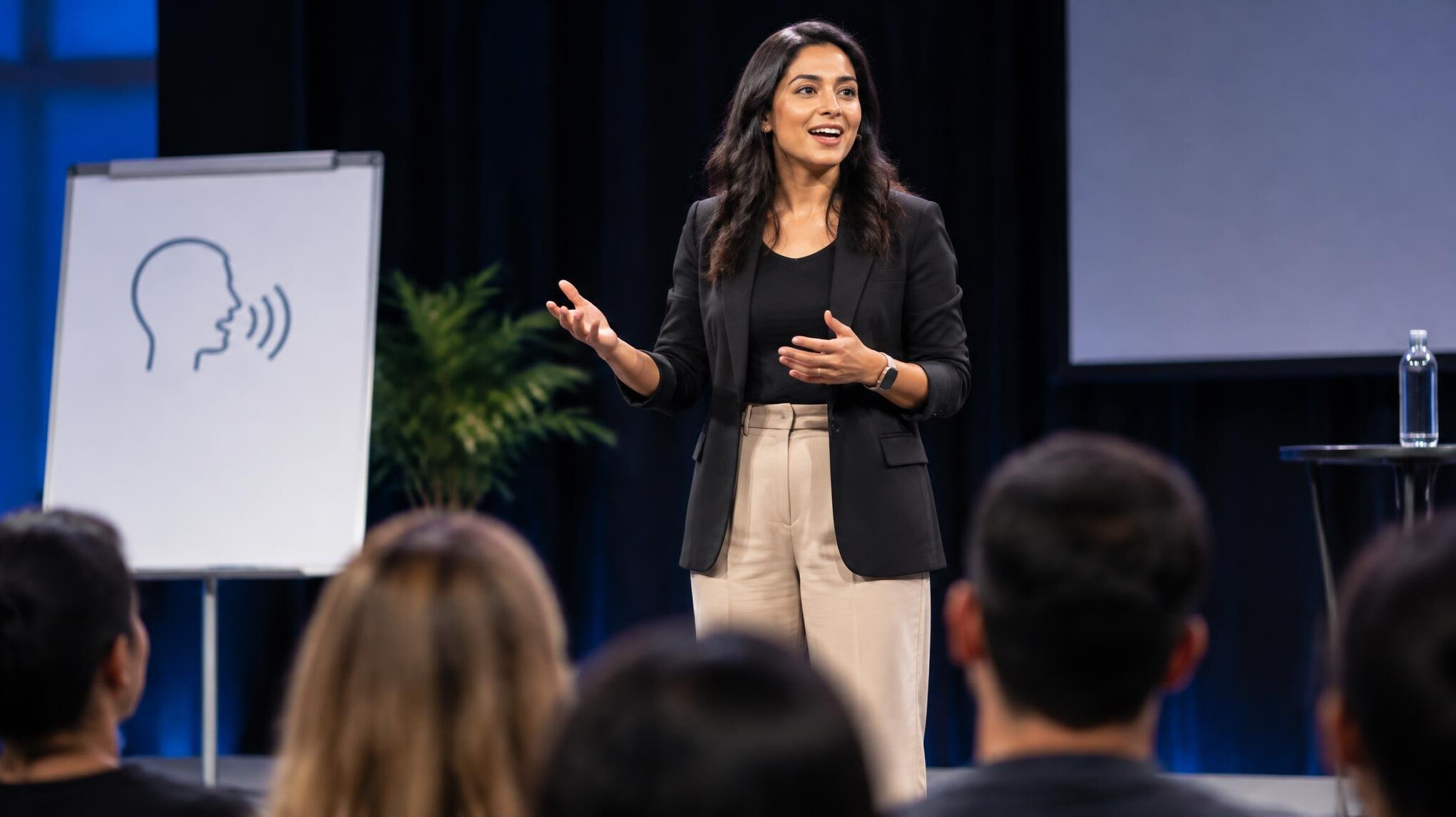 person giving speech on stage