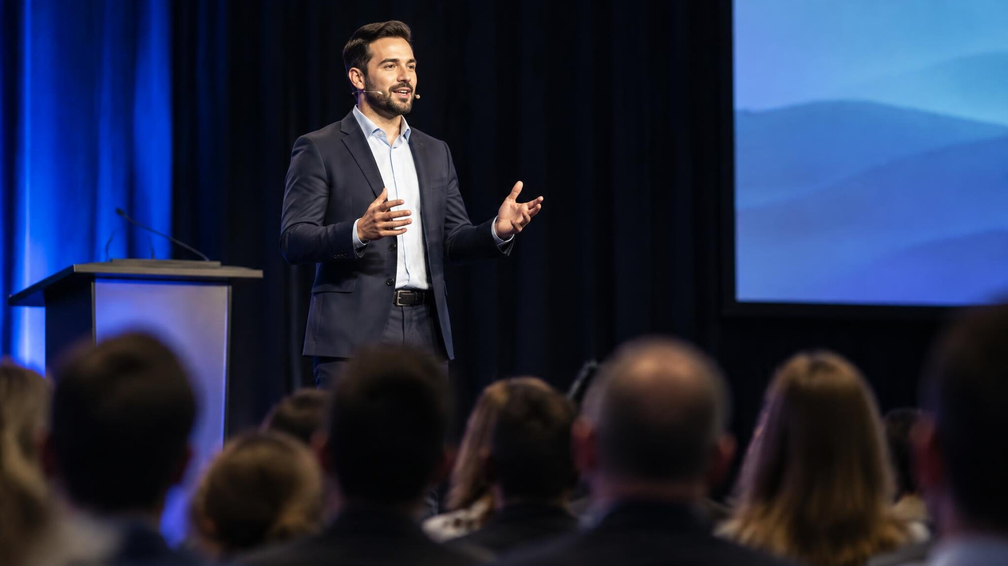 confident speaker on stage